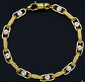 Bracciale uomo tubolare bicolore con la greca oro 18kt