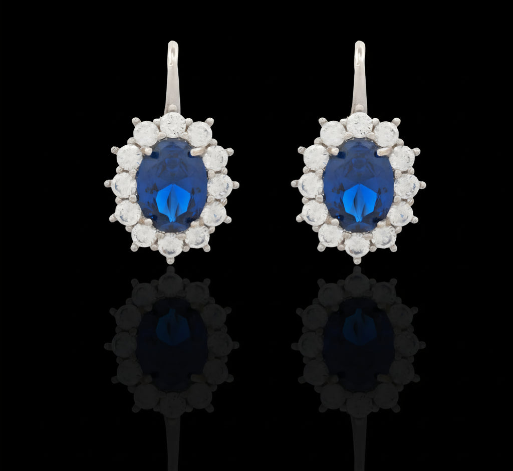 Orecchini piccoli con pietra blu e zirconi in oro bianco 18kt